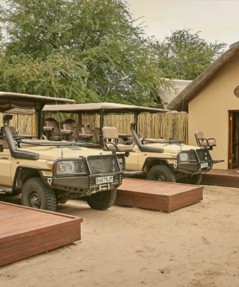Game safari vehicles, Deception Valley Camp, Botswana