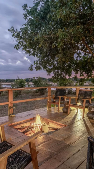 camp fire main area, time and tide kakuli bush camp, south luangwa national park, zambia
