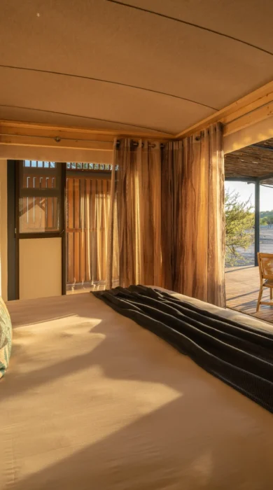 bed veranda view anderssons namibia yellow zebra safaris