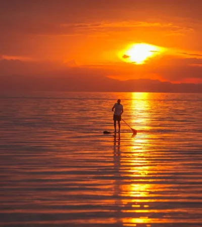 sunset paddle boarding, pumulani lodge, malawi
