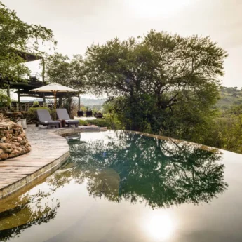 The sun is reflecting off a plunge pool, Singita Faru Faru Lodge, Tanzania - Yellow Zebra Safari