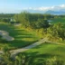 Golf course with a path cutting through the fairway, a bunker to the left, Mauritius - Yellow Zebra Safari