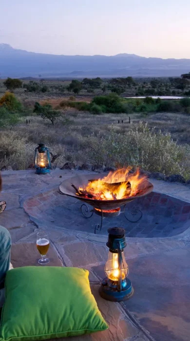 tortilis camp camp fire kenya yellow zebra safaris